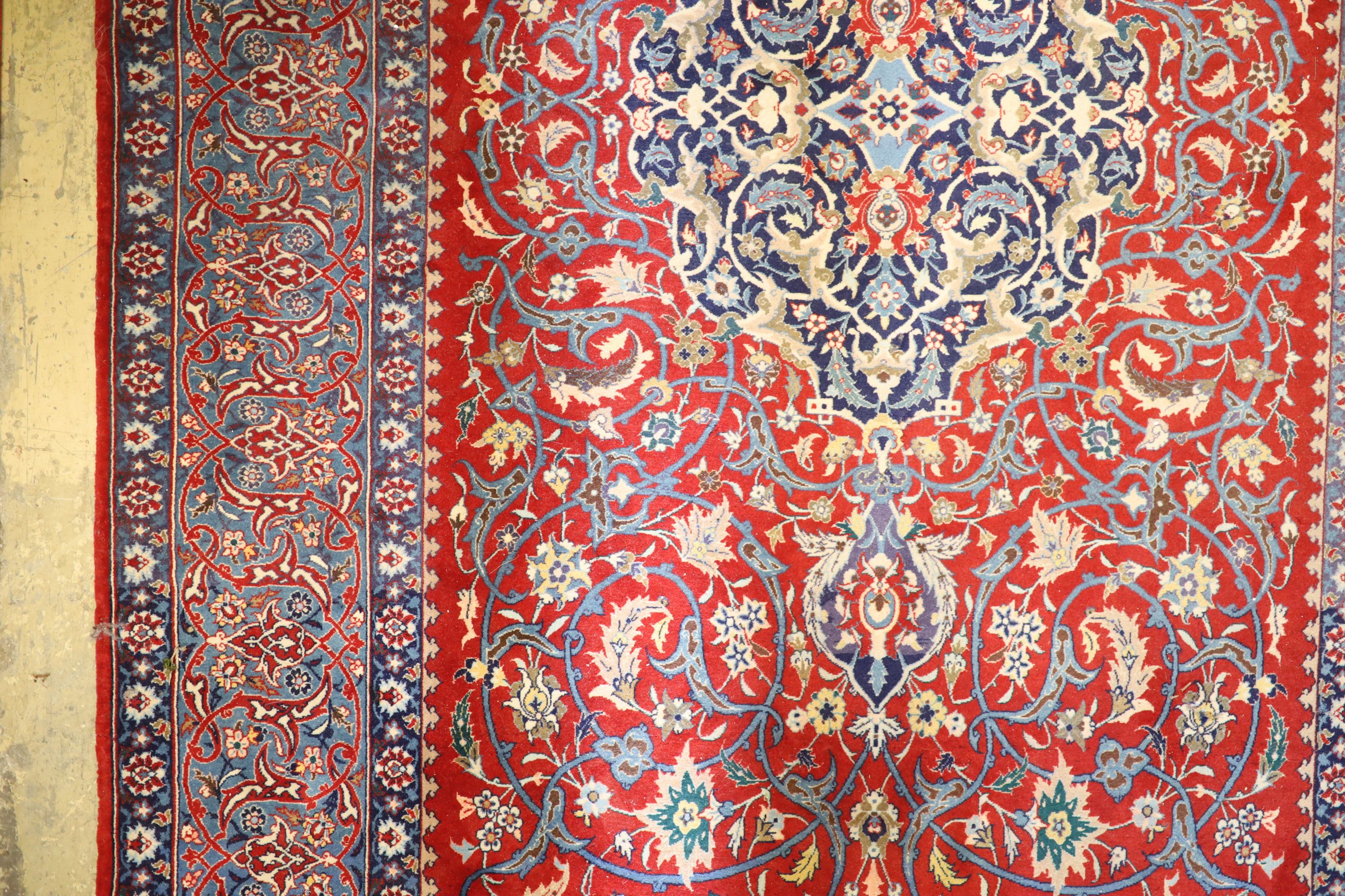 An Isfahan red ground rug, 169 x 110cm